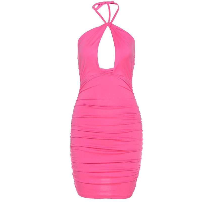 a pink dress with a cut out back