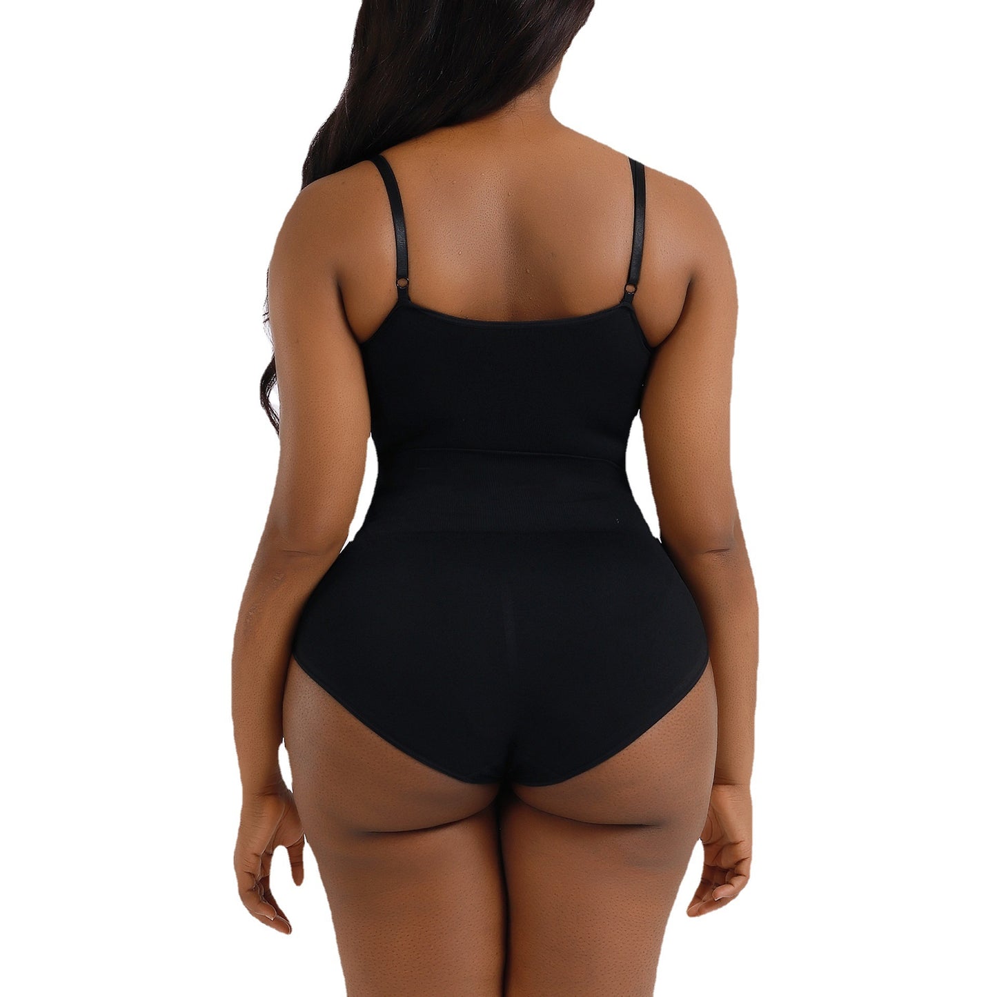 a woman in a black swimsuit with her back to the camera