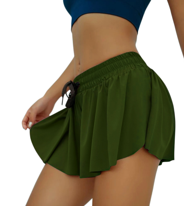a close up of a woman wearing a green skirt