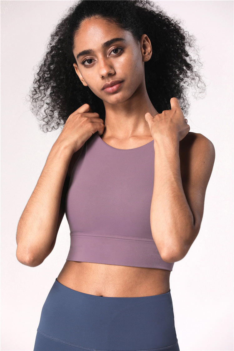 a woman in a sports bra top posing for a picture