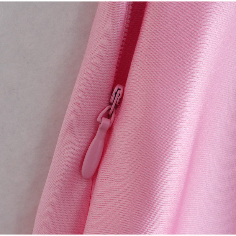 a close up of a pink shirt with a zipper